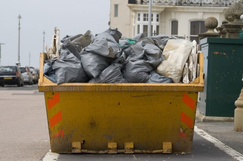 Professionals assessing a cluttered garage for clearance
