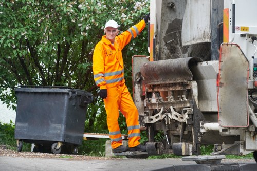 Workers sorting builders waste